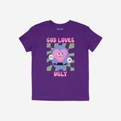God Loves Ugly T-shirt with a retro-style graphic, featuring a pink heart with arms and legs, promoting self-worth with messages Just be yourself and Strange Allies.