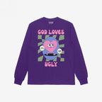God Loves Ugly T-shirt featuring a playful cartoon heart on a skateboard, surrounded by a wavy checkerboard circle and affirmations like 'Just be yourself,' promoting self-worth with bold, inclusive style.