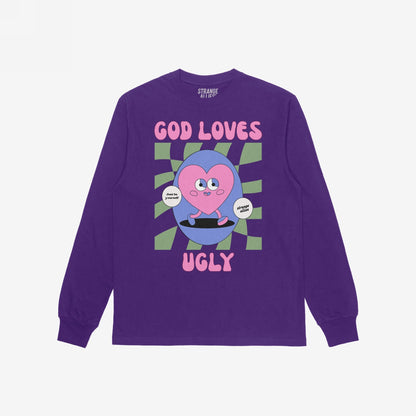 God Loves Ugly T-shirt featuring a playful cartoon heart on a skateboard, surrounded by a wavy checkerboard circle and affirmations like 'Just be yourself,' promoting self-worth with bold, inclusive style.