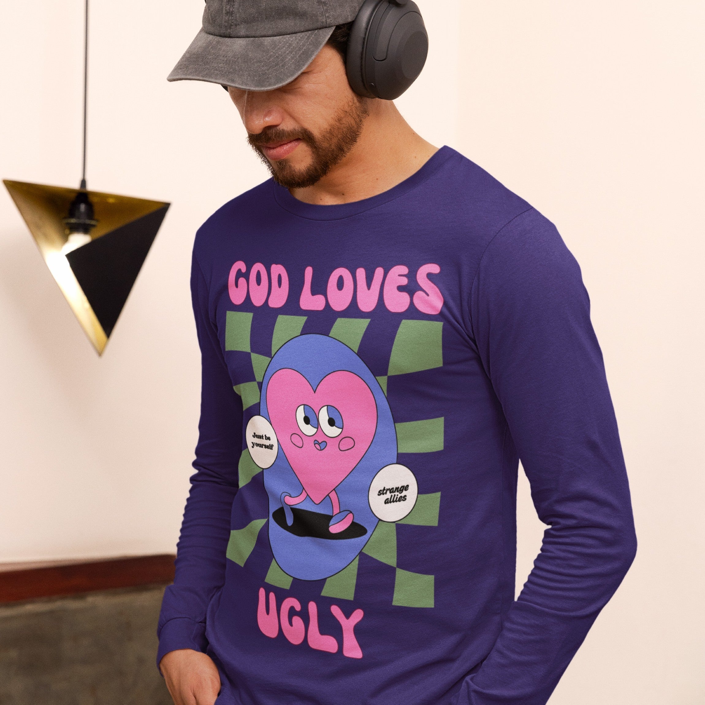 God Loves Ugly T-shirt featuring a retro pink heart cartoon with affirmations like “Just be yourself.” Perfect for embracing self-worth with a playful, inclusive message.