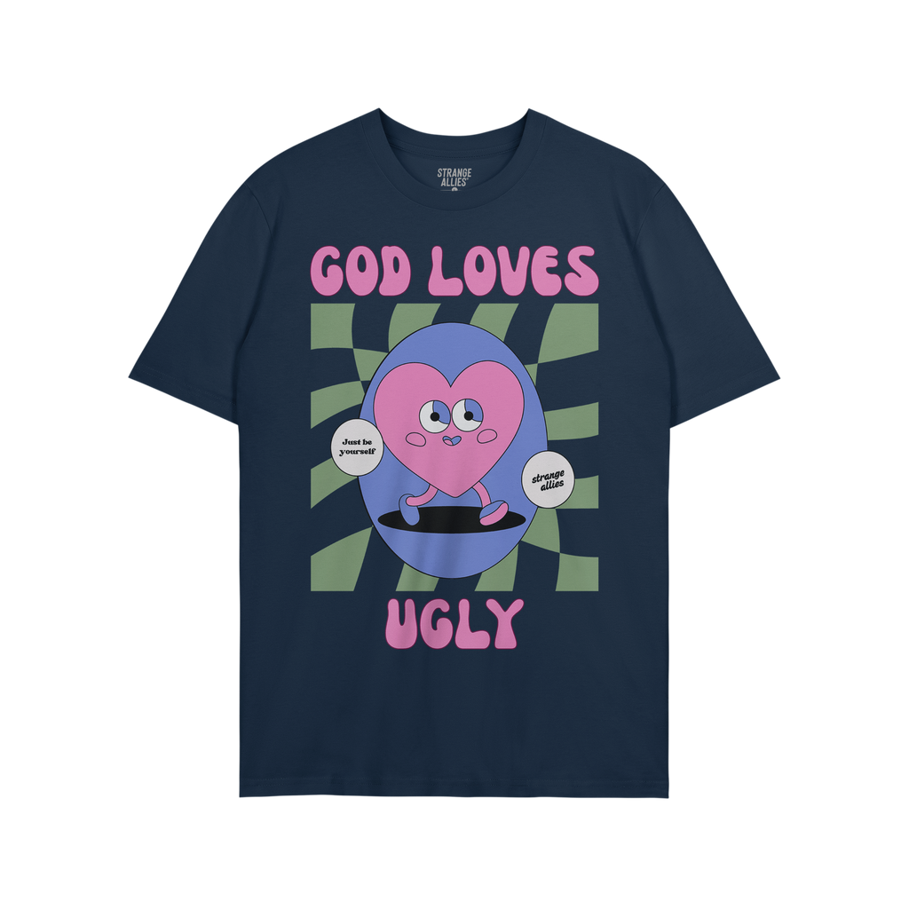 God Loves Ugly T-shirt featuring a cartoonish pink heart character with affirmations, embodying a bold, inclusive message of 