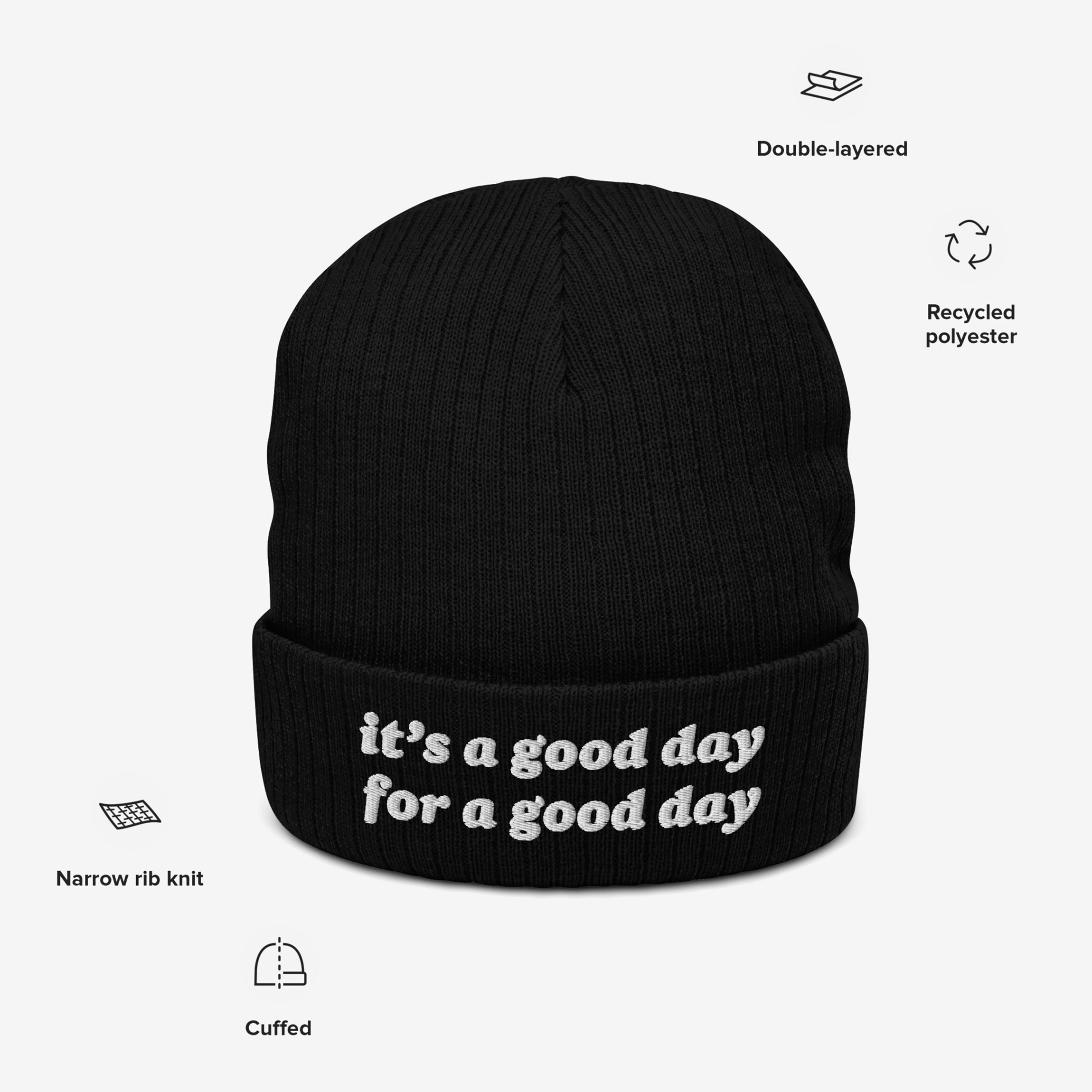 The Good Day Hat is a black, cuffed knit beanie with white embroidered text, it's a good day for a good day, featuring a narrow rib knit design made from recycled polyester.