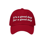 Red Good Day Hat with white embroidered text: it’s a good day for a good day. Perfect for spreading positivity and supporti