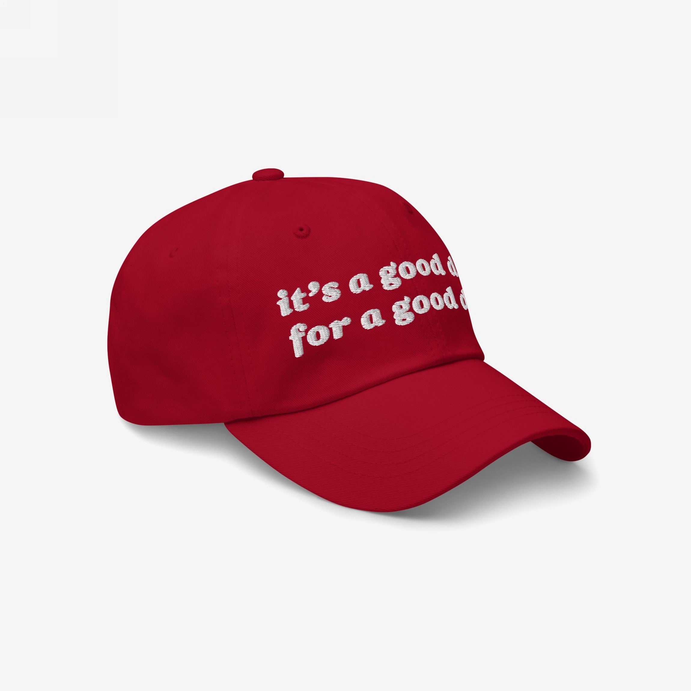 Red, curved-bill Good Day Hat with white embroidered text, it's a good day for a good day, promoting mental health positivity and kindness. Ideal for advocates of equality and uplifting spirits.