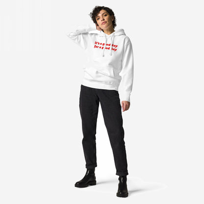 Model wearing the Good Day Hoodie, featuring red it's a good day for a good day text, paired with black jeans and chunky ankle boots, embodying positivity and casual style.