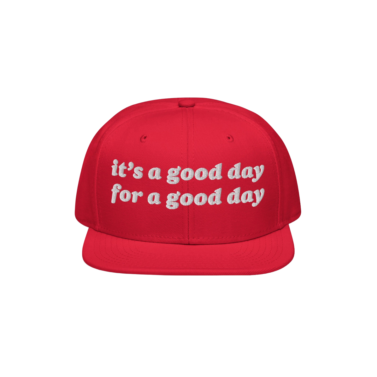 The Good Day Hat features white embroidered text stating it’s a good day for a good day on a red, flat-brim cap, promoting 