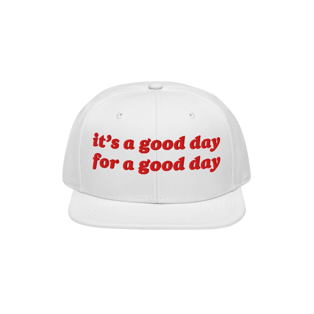 White flat-brim Good Day Hat with red embroidered text: “it’s a good day for a good day,” embodying positivity. Ideal f