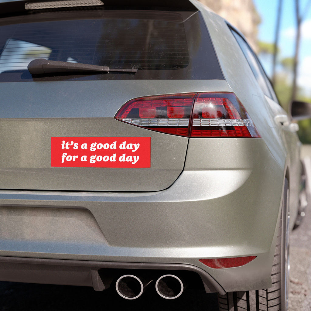Good Day Sticker & Magnet on a silver hatchback's tailgate, showcasing a motivational message. The bumper sticker reads it’s a good day for a good day, emphasizing optimism and resilience.