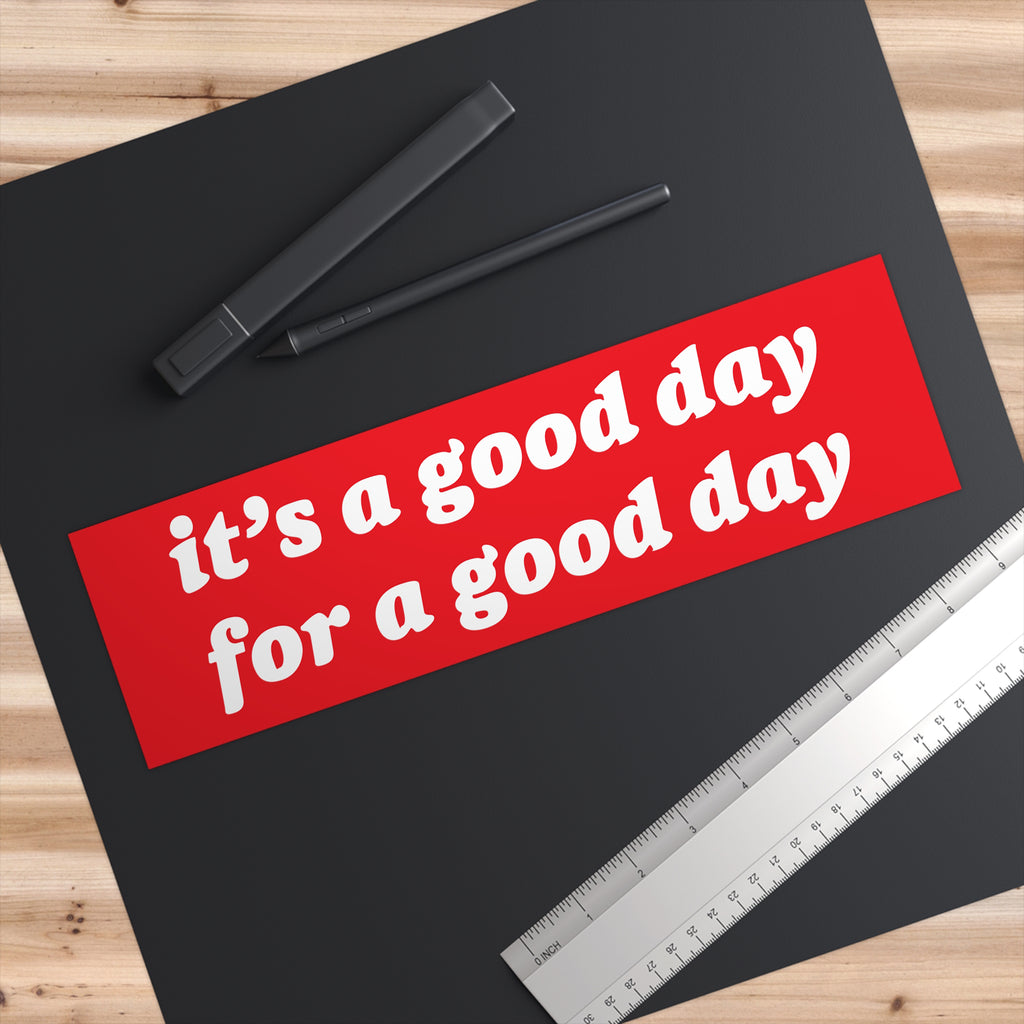 Good Day Sticker & Magnet on a black desk mat with stylus and ruler, featuring the slogan “it’s a good day for a good day,” promoting positivity with all-weather durability.