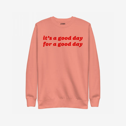 Good Day Hoodie & Sweatshirt features a soft-peach crewneck with bold red lettering, “it’s a good day for a good day,” offering comfort and positivity in a retro style.