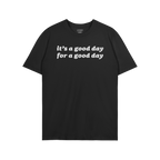 Black crew-neck Good Day Shirt with white, rounded text: it’s a good day for a good day. Embraces positivity and vintage vi