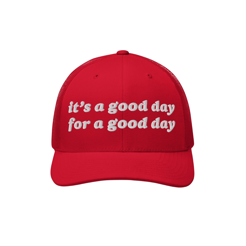 Good Day Hat: A red trucker-style cap with white embroidery that reads it's a good day for a good day, featuring a curved bil