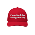 Good Day Hat: A red trucker-style cap with white embroidery that reads it's a good day for a good day, featuring a curved bil