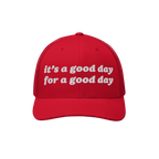Good Day Hat: A red trucker-style cap with white embroidery that reads it's a good day for a good day, featuring a curved bil