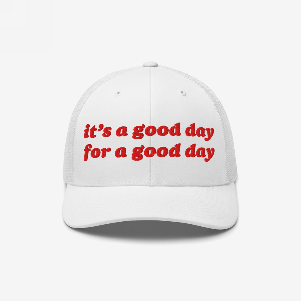 Good Day Hat: A white trucker-style cap with red embroidered text, it’s a good day for a good day, mesh back, and curved brim, promoting positivity and mental health awareness.