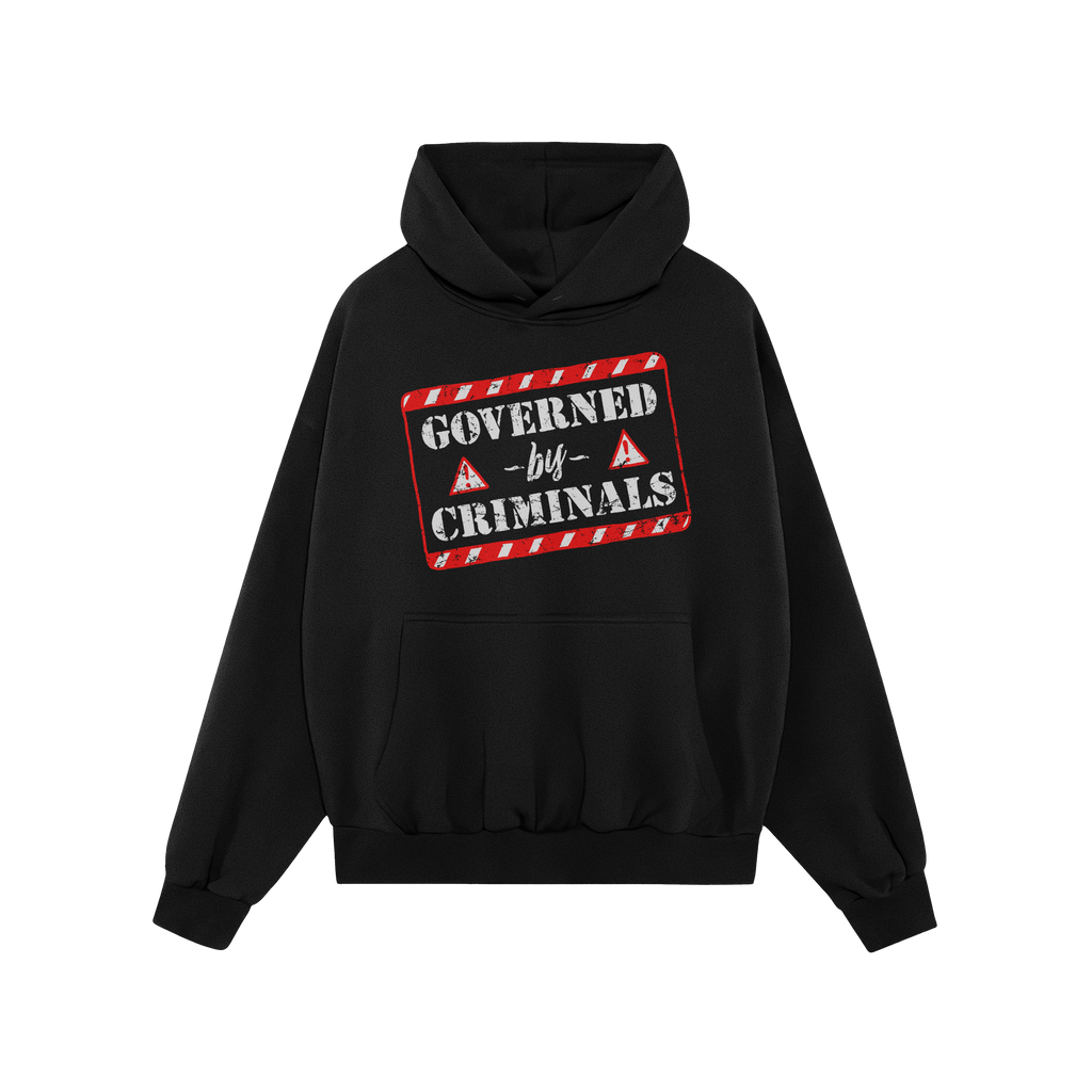 Black hoodie titled Governed By Criminals features a distressed red-and-white warning-tape style graphic and warning triangle