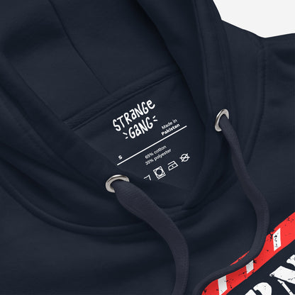 Governed By Criminals Hoodie close-up showing the hood with drawcords, neckline, and inner label. Part of a red-and-white graphic is visible, highlighting its bold, protest-inspired design.