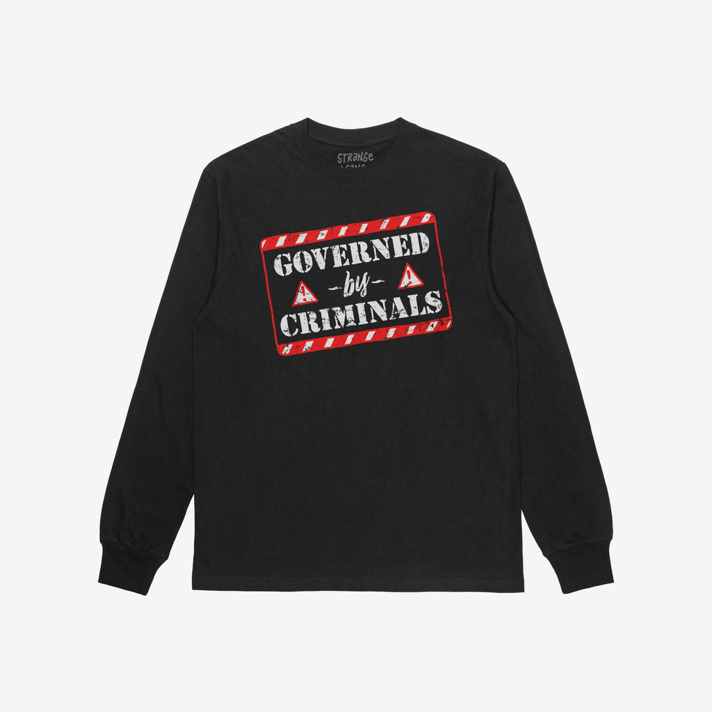 Black long-sleeve Governed By Criminals Shirt features a distressed graphic with red-white caution borders and bold text, embodying a rebellious stand against political corruption. Brand name printed inside collar.