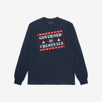 Navy-blue long-sleeve T-shirt with “Governed By Criminals” in distressed stencil lettering, featuring red-bordered warning graphics, symbolizing resistance against political corruption.