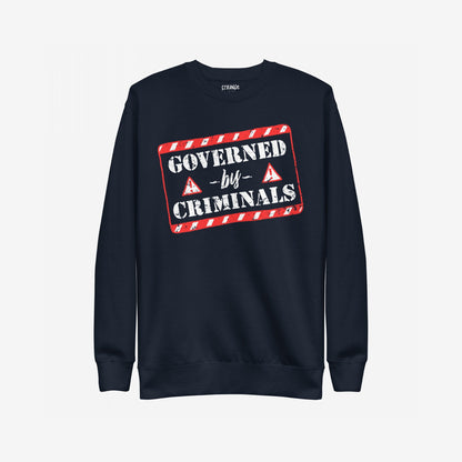 Governed By Criminals Hoodie & Sweatshirt featuring a distressed graphic with GOVERNED by CRIMINALS framed by a red-and-white border, embodying defiance against corruption and power hypocrisy.