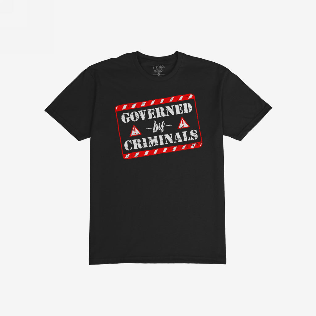 Black T-shirt featuring a bold graphic with red-and-white hazard stripes reading “GOVERNED by CRIMINALS,” alongside warning-triangle icons, embodying a rebellious stance against political corruption.