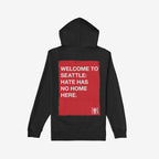 Custom Hate Has No Home Here Hoodie featuring bold red message on back, promoting unity and equality. Midweight, with front EGOPROOF logo. Ideal for activists and allies supporting anti-discrimination.