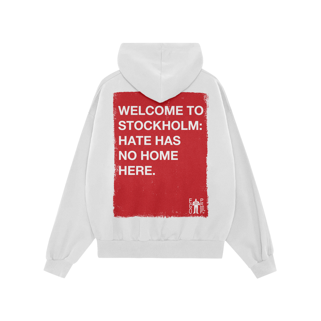 Back view of Custom Hate Has No Home Here Hoodie with large red rectangle and white text promoting unity. Features WELCOME TO