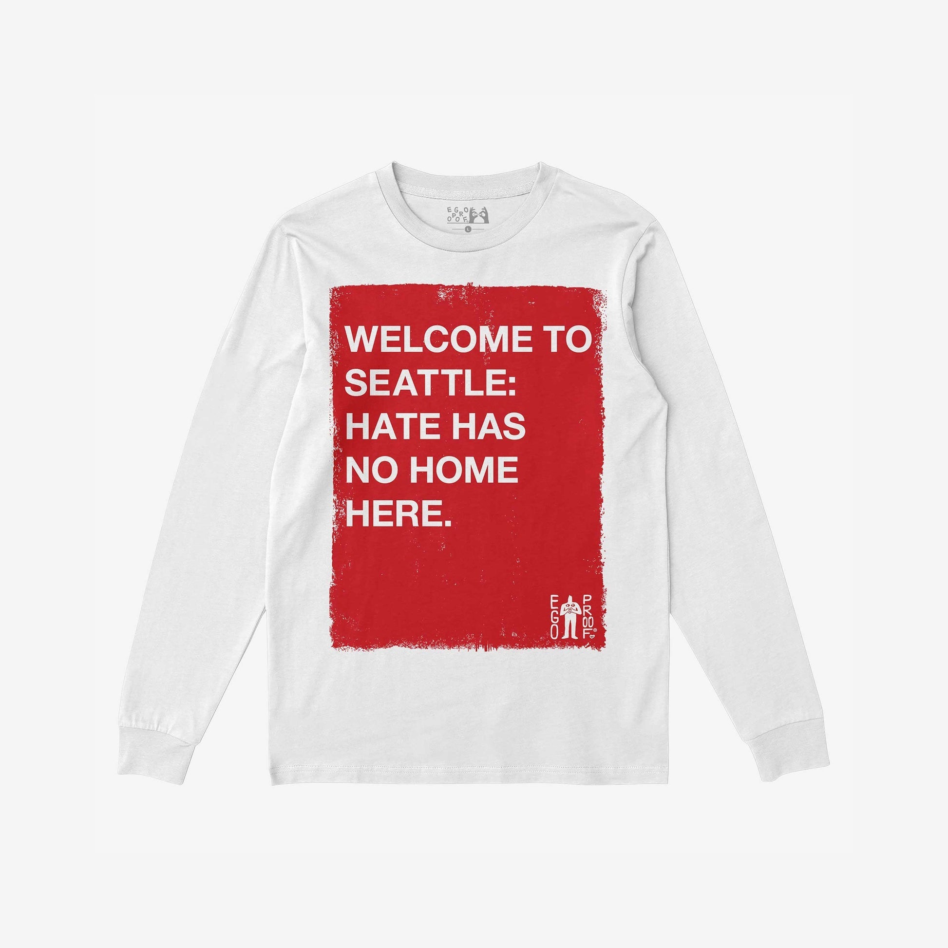 Custom Hate Has No Home Here Long Sleeve T-shirt featuring a bold red square with a message against hate, emphasizing community and equality. Ideal for activism, with “EGO PROOF” logo in the corner.
