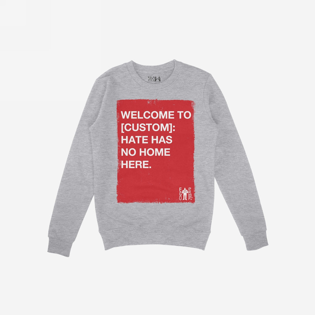 Custom Hate Has No Home Here Sweatshirt featuring a distressed red block with bold white text, perfect for advocating justice and equality. The design includes customizable city name for personalized activism.
