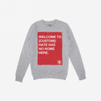 Custom Hate Has No Home Here Sweatshirt featuring a distressed red block with bold white text, perfect for advocating justice and equality. The design includes customizable city name for personalized activism.