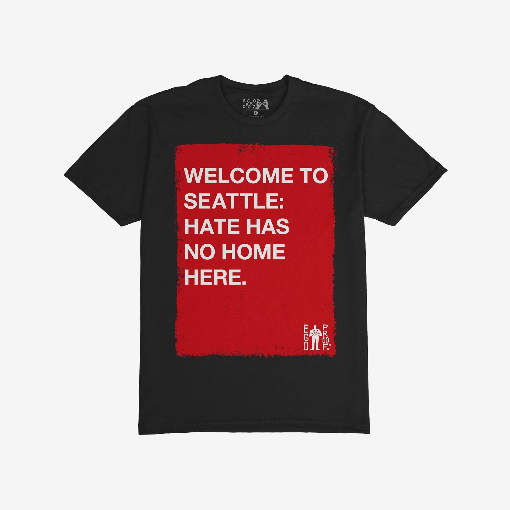 Custom Hate Has No Home Here T-shirt with a bold red rectangle featuring an inclusive message, perfect for promoting equity and justice. A small EGO PROOF. logo adds unique detail to this statement piece.