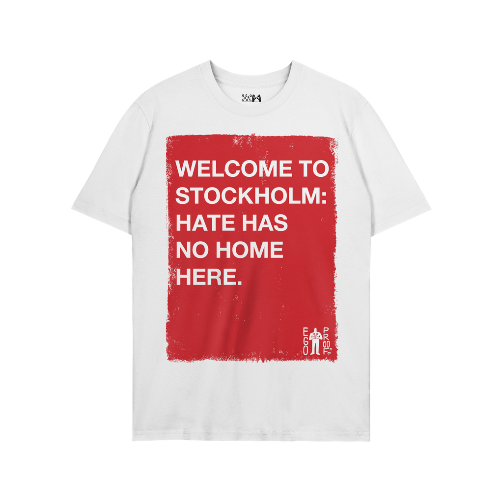 Custom Hate Has No Home Here T-shirt featuring a bold red graphic with white text, promoting inclusivity and justice. A minim