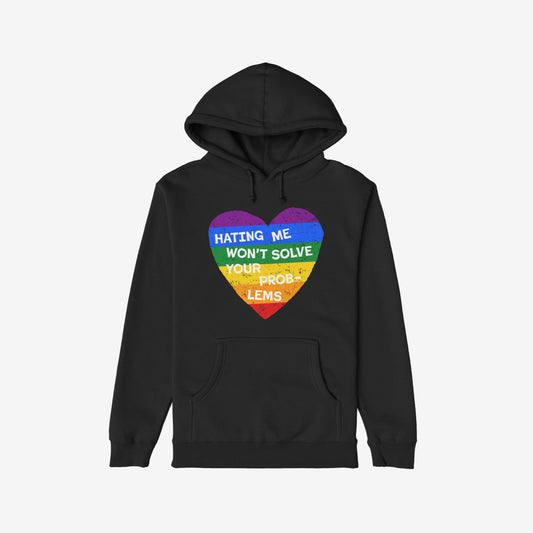 No LGBTQ Hate Shirt featuring a distressed-style rainbow heart on a black hoodie, emblazoned with the bold slogan “HATING ME WON’T SOLVE YOUR PROBLEMS,” embodying LGBTQ pride and resistance.