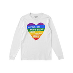 The No LGBTQ Hate Shirt features a white long-sleeved tee with a rainbow-striped heart and the slogan HATING ME WON’T SOLVE