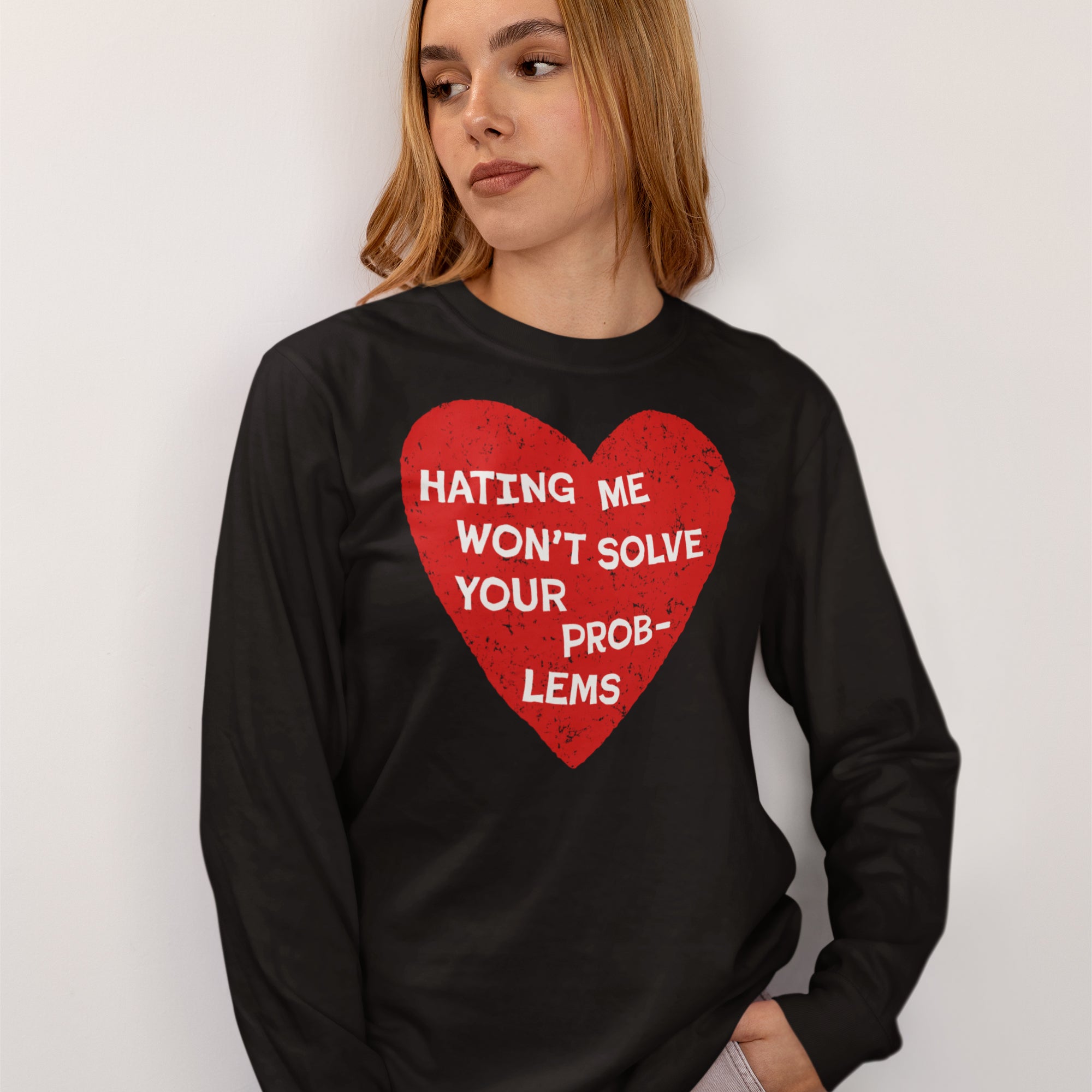 No Hate Shirt featuring a distressed red heart and HATING ME WON’T SOLVE YOUR PROBLEMS slogan, worn by a person. Advocates for LGBTQ and immigrant rights, supporting The Trevor Project.
