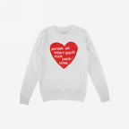 White crew-neck sweatshirt featuring a bold red heart with distressed edges, emblazoned with the phrase HATING ME WON’T SOLVE YOUR PROBLEMS, expressing the No Hate Shirt's message of love and equality.