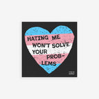 No Trans Hate Sticker & Magnet features a distressed heart with transgender-pride stripes and bold lettering, HATING ME WON’T SOLVE YOUR PROBLEMS, emphasizing trans-affirmation. Available as a magnet or sticker.