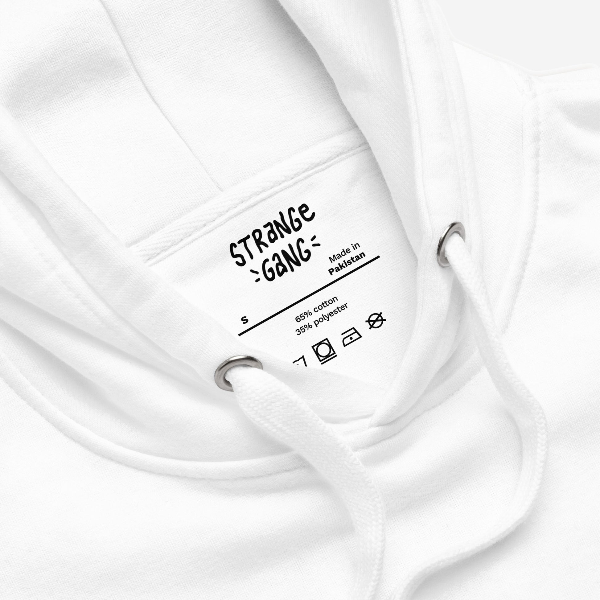Close-up of the Minnesota No Kings Flag Hoodie & Sweatshirt, showcasing the inside neck label with details: “Made in Pakistan,” size “S,” fabric 65% cotton, 35% polyester, and care symbols.