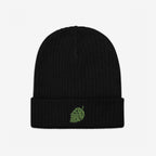 The Hop Nug Hat features a black rib-knit beanie with a green hop-cone motif embroidered on the cuff, ideal for craft beer enthusiasts who appreciate casual, confident style.