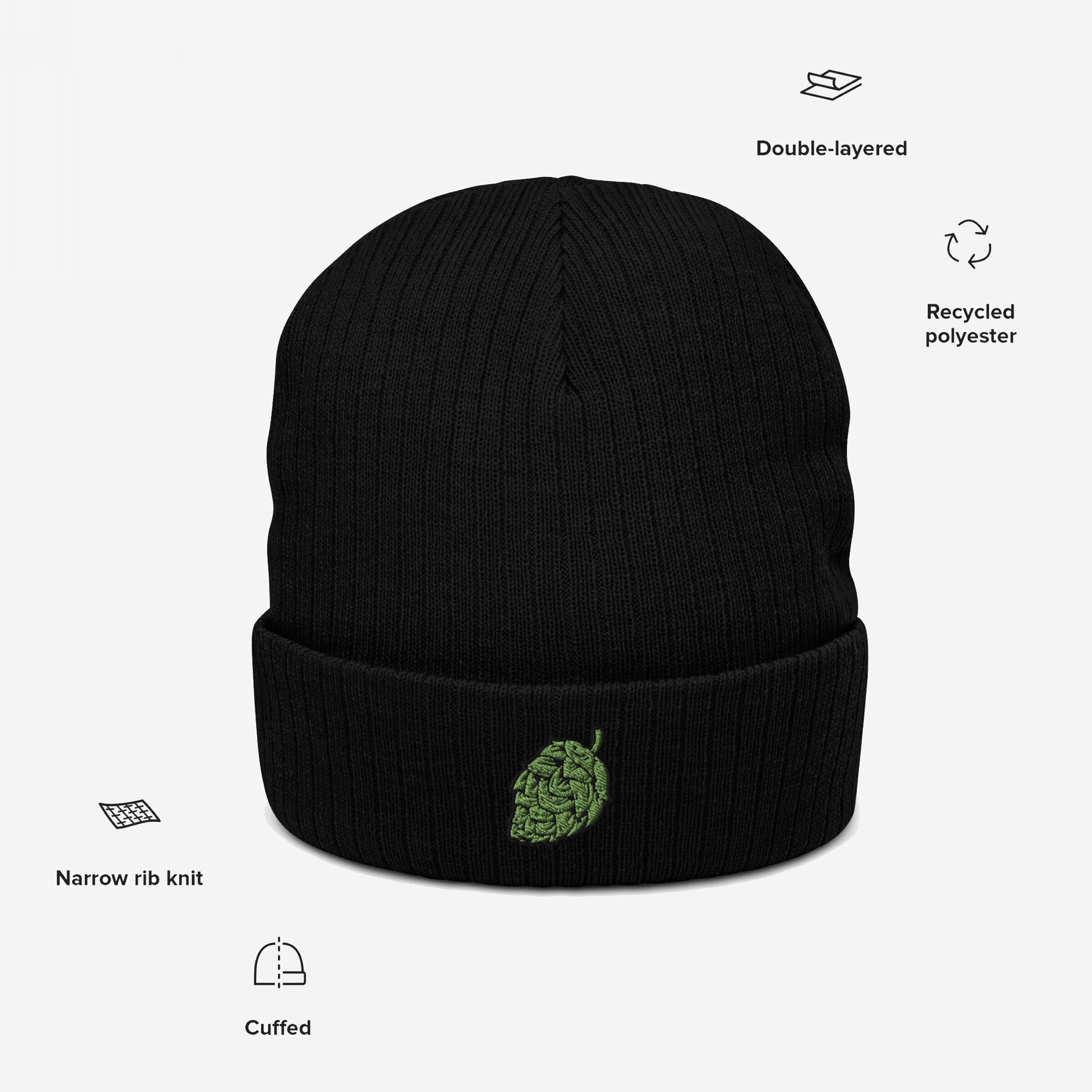 Hop Nug Hat: Black, cuffed knit beanie featuring a green hop-cone embroidery on the cuff, crafted from double-layered recycled polyester with a narrow rib-knit design, perfect for craft beer enthusiasts.