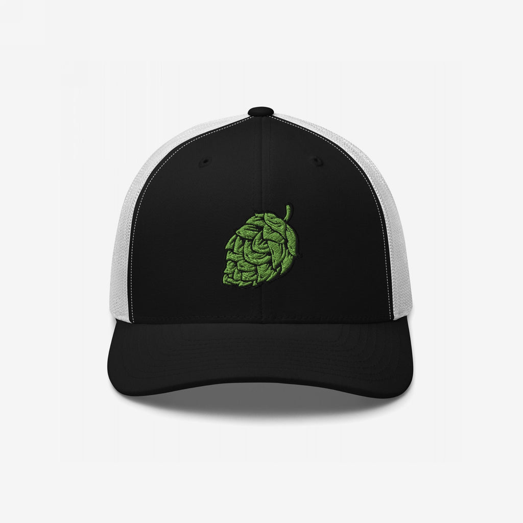 The Hop Nug Hat features a black front with a green embroidered hop cone, ideal for craft beer enthusiasts who appreciate casual, confident style in a classic trucker cap design.