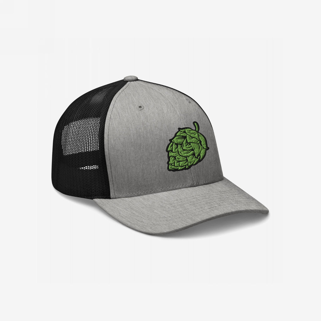 The Hop Nug Hat features a heather gray front with a green hop-cone embroidery, complemented by black mesh back panels, perfect for craft beer enthusiasts who appreciate style and substance.