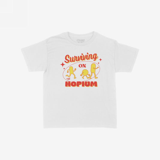 Hopium Women's Baby Tee featuring a playful retro design with Surviving on Hopium in bold lettering and cartoon pill-shaped characters, capturing a whimsical, defiant attitude.