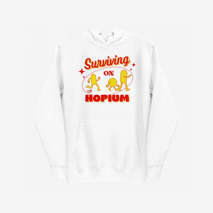Hopium Hoodie & Sweatshirt features a white hooded design with a bold red-and-yellow graphic, Surviving on HOPIUM, adorned with whimsical pill characters, embodying a lifestyle of optimistic rebellion.