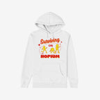 White hoodie featuring the Hopium Shirt design with cartoon figures and retro text Surviving on HOPIUM, symbolizing wishful thinking. A playful garment supporting mental health awareness through NAMI donations.