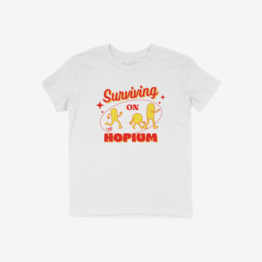 Hopium Shirt: A whimsical white tee showcasing vibrant red and yellow pill characters under Surviving on HOPIUM, perfect for embracing optimism and quirky individuality. Benefits NAMI. Available in various styles.