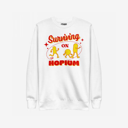 Hopium Hoodie & Sweatshirt features a white crewneck with bold “Surviving on HOPIUM” text and playful retro characters, embodying optimistic rebellion and creative expression. Ideal for dreamers and hope enthusiasts.