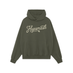 Forest-green Hopsmash Hoodie with kangaroo pocket, featuring cream script logo and hop-cone graphic, embodies hop devotion. P