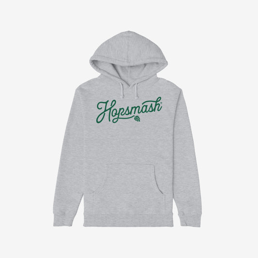 Hopsmash Hoodie & Sweatshirt features a light-gray hoodie with Hopsmash in green cursive across the chest and a hop-cone graphic, embodying a bold devotion to hops.