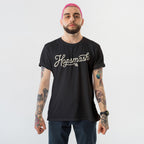 Hopsmash T-shirt worn by a young adult with pink hair and tattooed arms, embodying a bold, rebellious style in line with the store's advocacy for equality and self-expression.